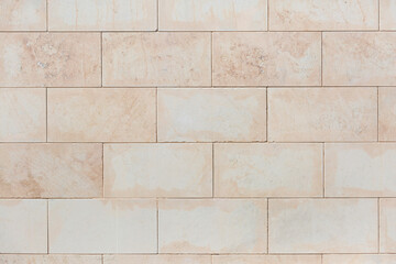 Obraz premium Beige brick wall as a background, texture, pattern.