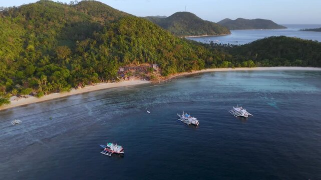 Drone aerial view of KMAAL campsite in Linapacan near Coron in The Philippines.
