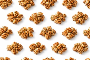 Obraz premium Studio photo grilled chicken pieces arranged as repeating mini clusters pattern top view isolated on white background