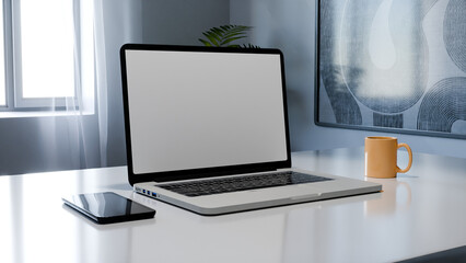 Fototapeta premium Minimalist modern workspace with laptop, smartphone and coffee cup