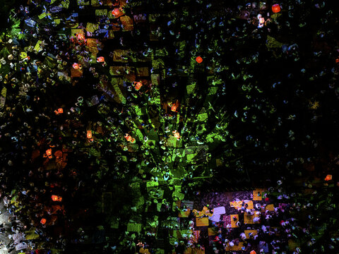 Aerial view of a sea of vibrant lanterns casting a warm glow over the Parangtritis Lantern Festival, illuminating the Yogyakarta night, Yogyakarta, Special Region of Yogyakarta, Indonesia.