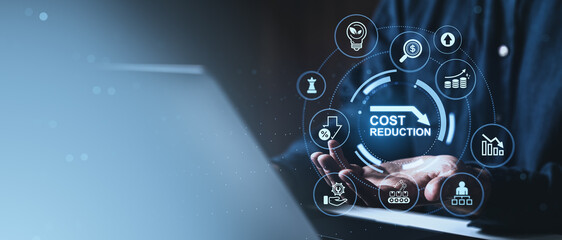 Cost reduction digital interface over hands with business icons on blue background, surrounded by...