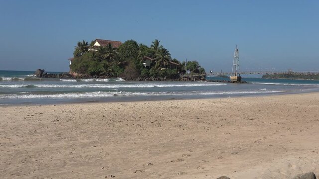 Island with a Buddhist temple Paravi Duwa Temple (Temple on the island). Matara, Sri Lanka