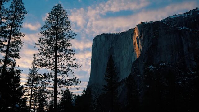 Wide shot of beginning of Yosemite's firefall event in Horsetail Fall and El Capitan.