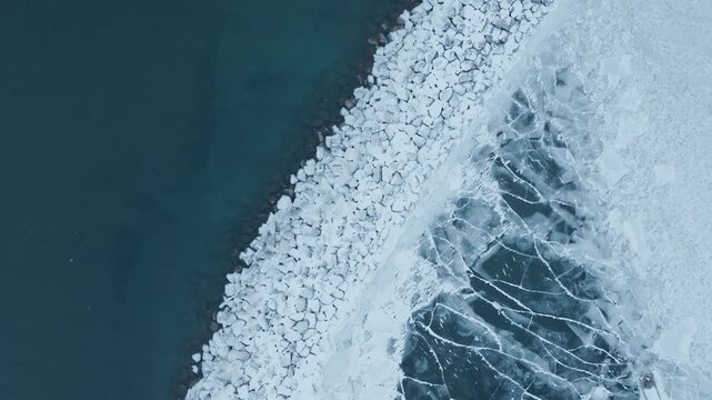 Aerial view of icy Bronte Harbour on Lake Ontario in winter