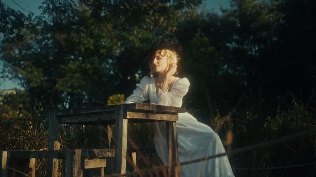 Peaceful Woman In Nature Setting. Tranquil Woman Dressed Flowing In Rural Shaded Woodland Scenery