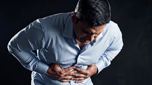 Man clutching stomach in pain