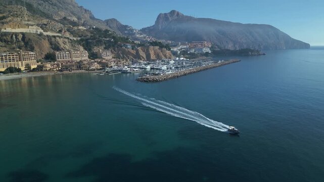 Motorboat leaving the marina on a sunny day