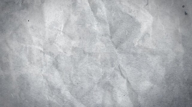 A creased and textured paper tear reveal background with alpha that animates to fill screen in a stop motion style. 
