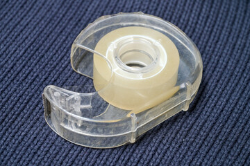 A used adhesive tape dispenser for the office