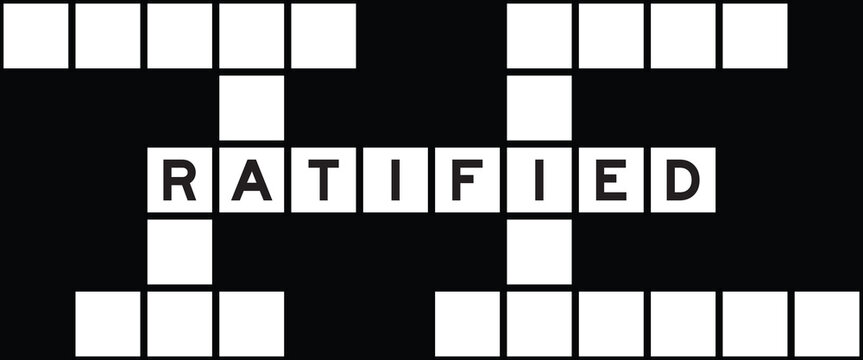 Alphabet letter in word ratified on crossword puzzle background
