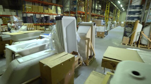 Wholesale Plumbing Warehouse inside. Plumbing Supply. Acrylic bathtubs, close-up. Plumbing Materials and Supplies warehouse. Plumbing and Bathroom Supplies warehouse.
