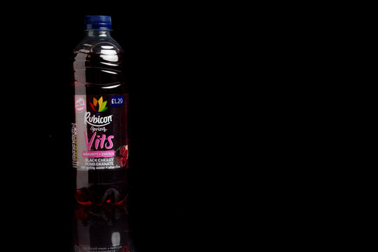 A Bottle of Rubicon Spring Vits  against a black background