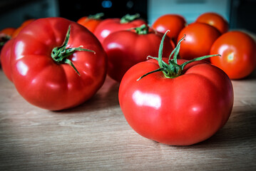 Ripe red organic tomatoes on the kitchen table