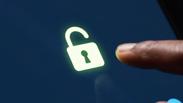 Finger touching glowing button in dark background, activating technology