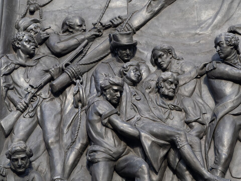 close up of the bronze plaque at the base of Nelson's column Trafalgar Square in London