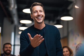 Naklejka premium Unique diverse dynamic interesting Happy relaxed confident young businessman presenting at a team meeting