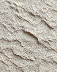 Naklejka premium A close-up, textured macro shot of a light beige sandstone surface with dramatic shadows highlighting its natural, rugged contours.