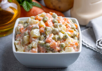 Fototapeta premium Russian salad, Olivier salad with mayonnaise and egg served (Turkish name; Rus salatasi)