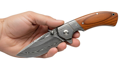 Obraz premium Man's hand holding a Damascus steel folding knife with a wooden handle, isolated on white background. Close-up view.