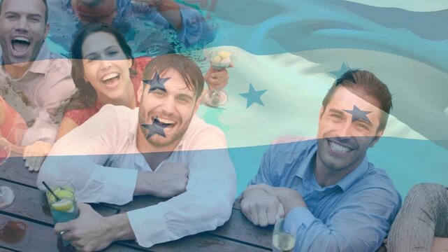Animation of flag of honduras over happy caucasian friends having fun at swimming pool