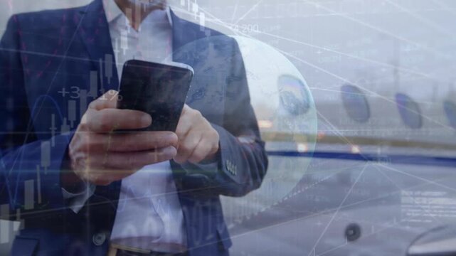 Animation of binary codes, graphs, globe on businessman using cellphone against airplane