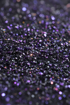 Black plum grain with violet sparkles background
