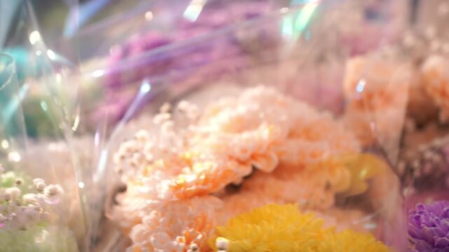 A bunch of bouquets of flowers. Lots of different flowers like multicolored Chrysanthemum