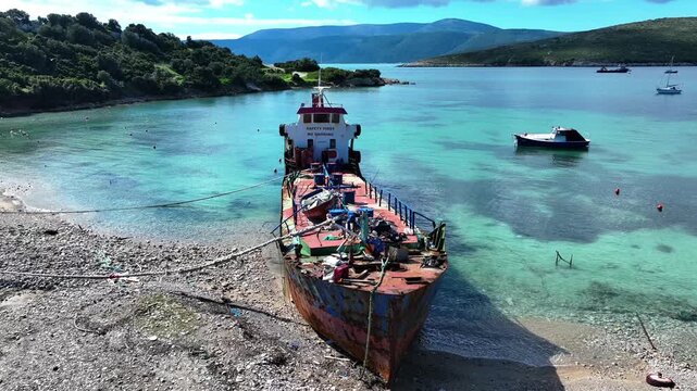 Stranded Cargo Ship on Shore &ndash; Aerial Drone View of Grounded Vessel Near Coastline