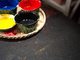 Colorful Paints Rest on Woven Tray