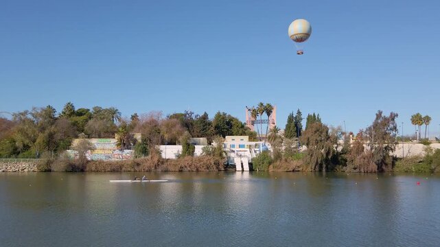 Guadalquivir gardens and Expo 1992 Cartuja district in Seville, Spain, as seen from the river