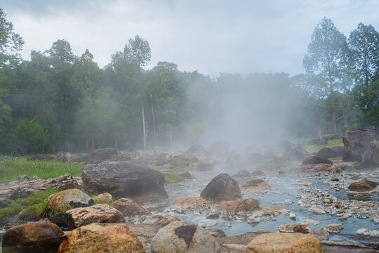 Jae son Hot Spring: Steam from geothermal heat rises from the spring. Located in Jae son National Park, Lampang Province, Thailand.