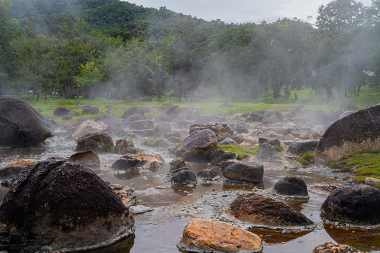 Jae son Hot Spring: Steam from geothermal heat rises from the spring. Located in Jae son National Park, Lampang Province, Thailand.