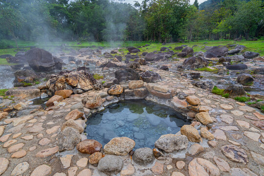 Jae son Hot Spring: Steam from geothermal heat rises from the spring. Located in Jae son National Park, Lampang Province, Thailand.