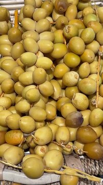 raw dates on a branch palm fruit tasty snack fresh gourmet food background on the table rustic food top view copy space dark background keto and paleo diet vegetarian and vegan food 