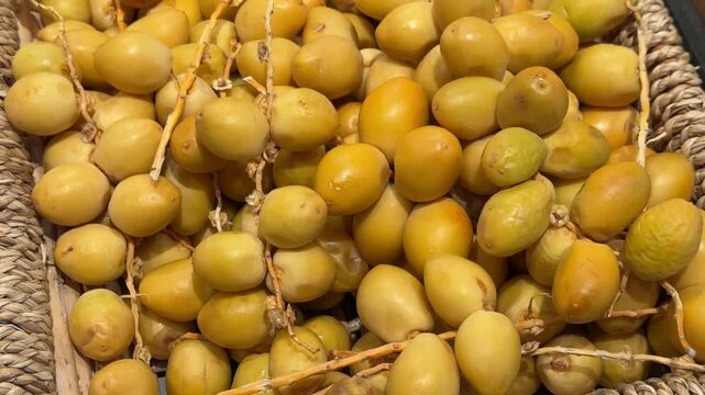 raw dates on a branch palm fruit tasty snack fresh gourmet food background on the table rustic food top view copy space dark background keto and paleo diet vegetarian and vegan food 