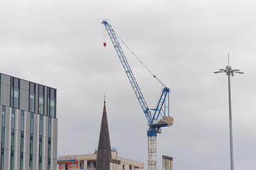 Tower cranes high in sky at construction site © Richard Johnson