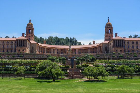 South Africa,Union Buildings,Grand historical building with symmetrical architecture and landscaped gardens under a clear blue sky