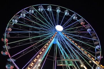 Fototapeta premium Night Carnival at Ohio State Fair with Neon Rides and Colorful Lights