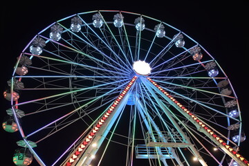 Fototapeta premium Night Carnival at Ohio State Fair with Neon Rides and Colorful Lights
