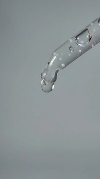 Liquid dripping slowly from the tip of the serum pipette