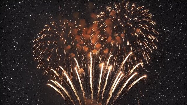 Brilliant Golden Fireworks Exploding Against a Starry Night Sky, Celebrating Festive Occasions
