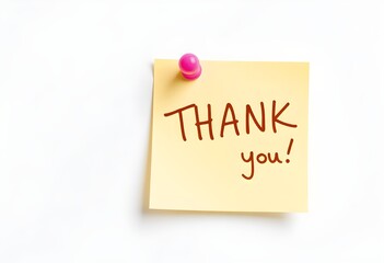 Sticky note with thank you message pinned on white wall from overhead viewpoint