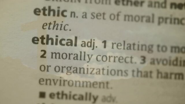 Lens pulling focus, letters resolving, sharpening, revealing ethical definition via cloud overlay