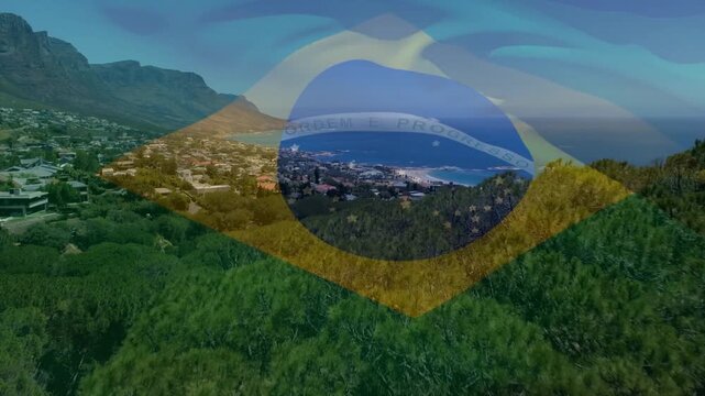 On play Brazilian flag overlay pulsing as aerial camera panning right, revealing coastal harbor