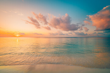 Fototapeta premium Closeup sea sand beach. Panoramic beach landscape. Inspire tropical beach seascape horizon. Orange and golden sunset sky calmness tranquil relaxing sunlight summer mood. Vacation travel holiday banner