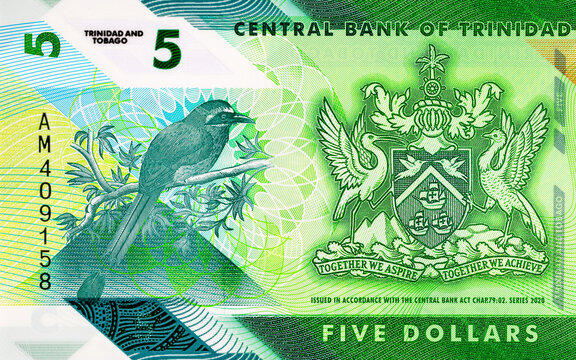 Macro detail of the Trinidad and Tobago 5 Dollar polymer banknote featuring the National Coat of Arms. Plastic money Trinidad and Tobago