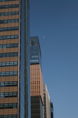 Fototapeta premium Modern office buildings and skyscrapers under a clear blue sky