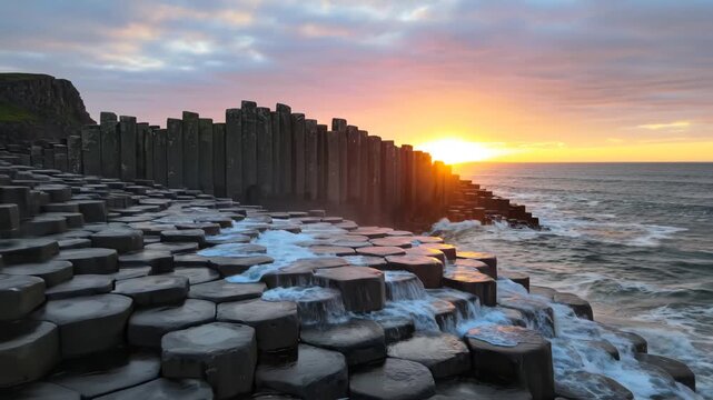 Sunset at Hexagonal Rock Formation by Ocean
