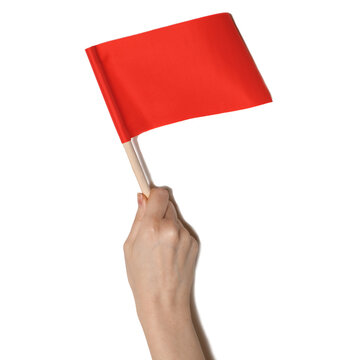 Hand holding small red flag isolated on transparent background. Warning, alert, protest and signaling concept. PNG cutout object.